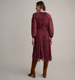 Model is wearing UNTUCKit Carly printed red dress. 