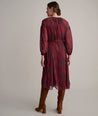 Model is wearing UNTUCKit Carly printed red dress. 