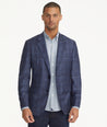 Model is wearing UNTUCKit Italian Wool Carrington Sport Coat in Navy check.