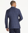 Model is wearing UNTUCKit Italian Wool Carrington Sport Coat in Navy check.