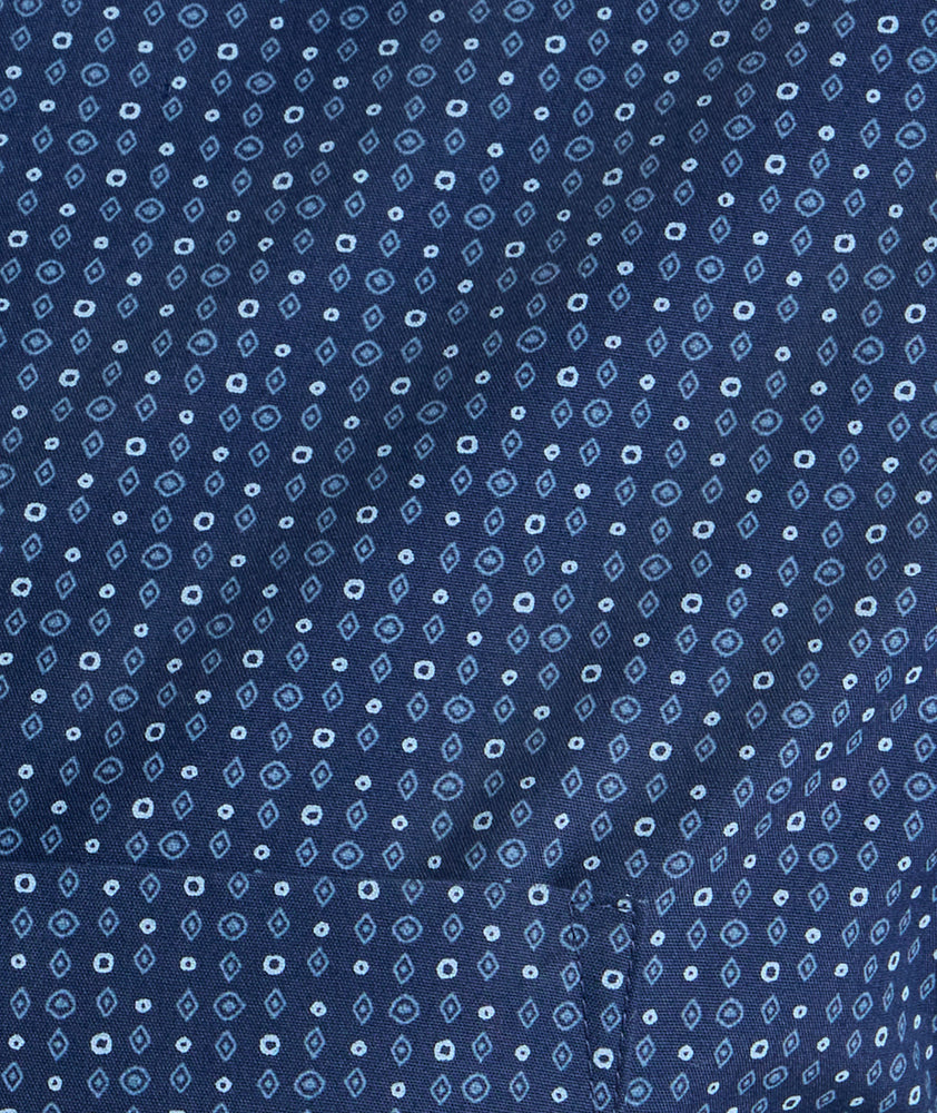 Model is wearing UNTUCKit Wrinkle-Free Cascadar Shirt in navy. 