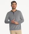 Model is wearing UNTUCKit Cascudo long sleeve pique henley in sky Captain.