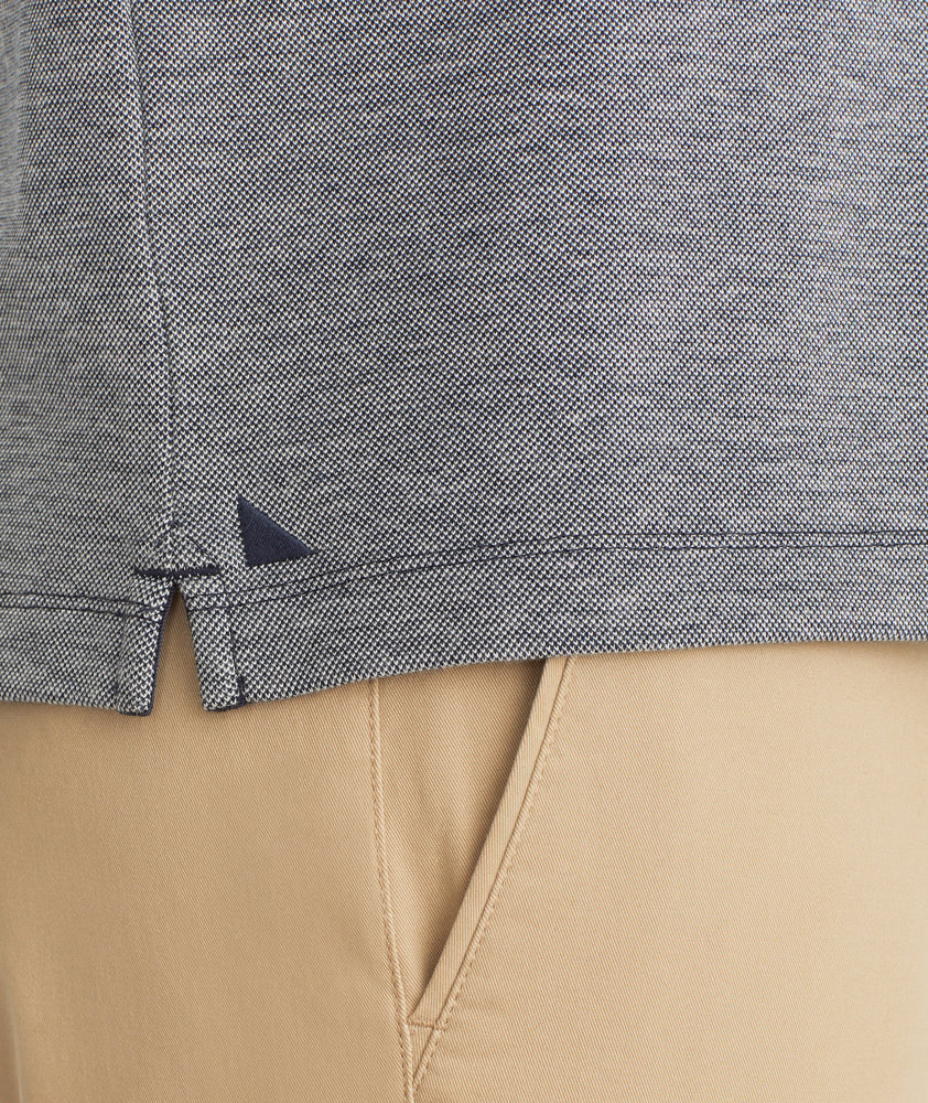 Model is wearing UNTUCKit Cascudo long sleeve pique henley in sky Captain.