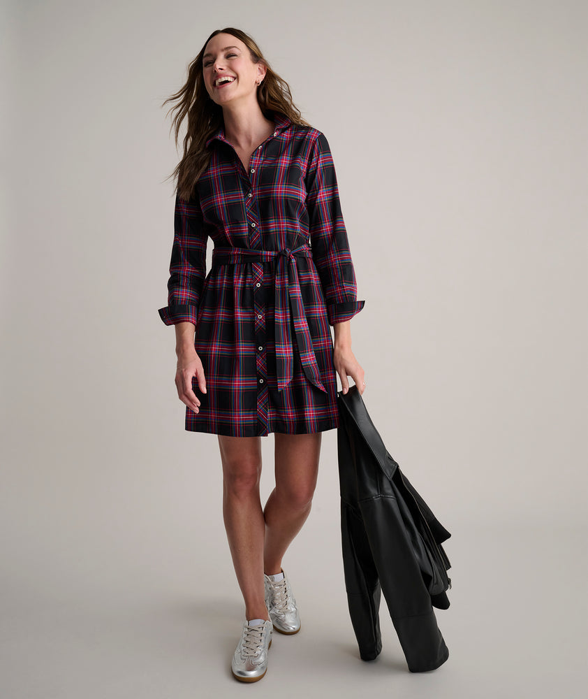 Model is wearing UNTUCKit Cassie dress in purple plaid. 