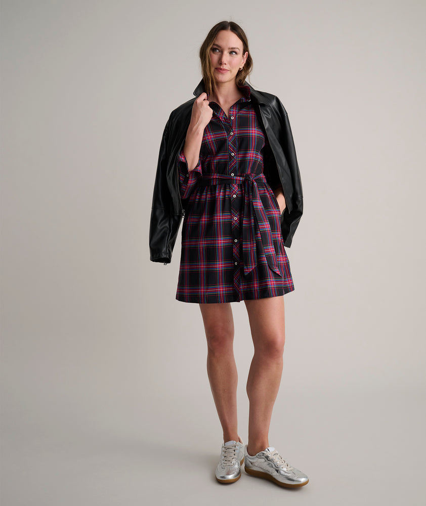 Model is wearing UNTUCKit Cassie dress in purple plaid. 