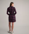 Model is wearing UNTUCKit Cassie dress in purple plaid. 