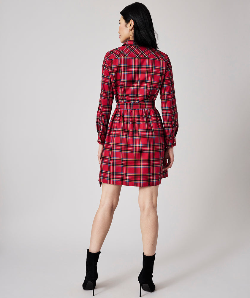 Model is wearing UNTUCKit Cassie dress in red plaid.