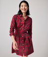 Model is wearing UNTUCKit Cassie dress in red plaid.