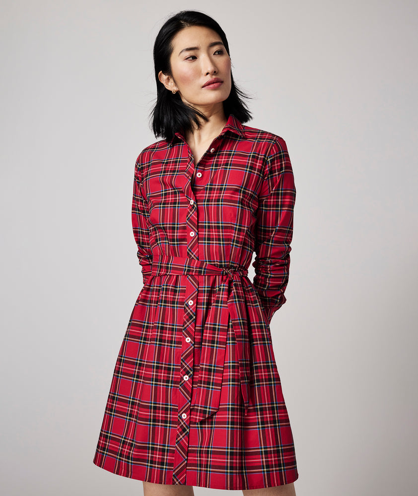 Model is wearing UNTUCKit Cassie dress in red plaid.