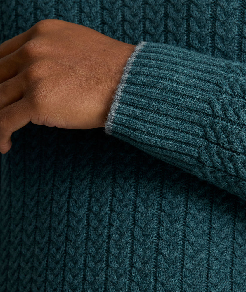 Model is wearing UNTUCKit Cable-Knit Button Neck Sweater in forest. 