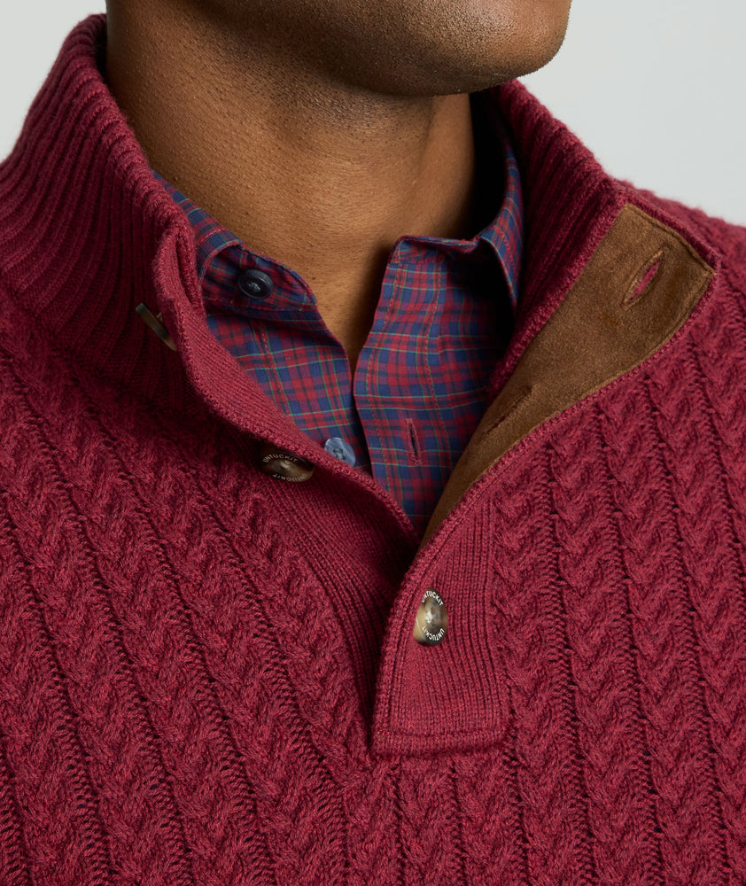 Model is wearing UNTUCKit Cable-Knit Button Neck Sweater in red. 