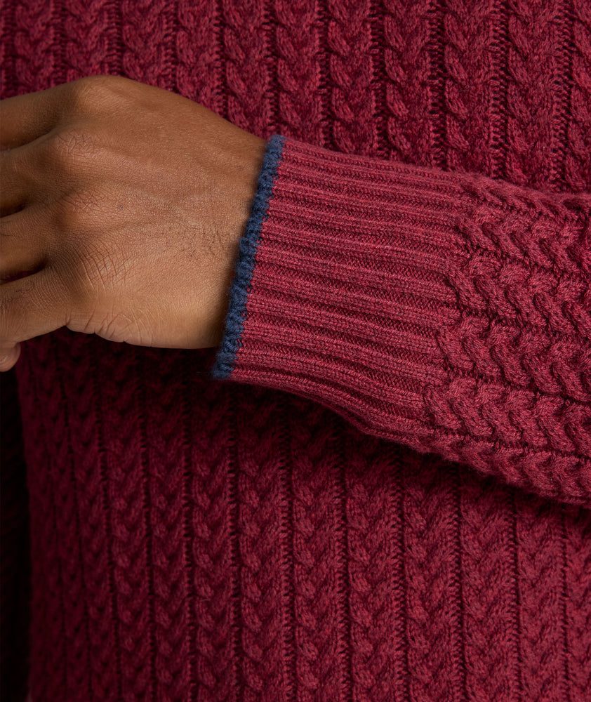 Model is wearing UNTUCKit Cable-Knit Button Neck Sweater in red. 