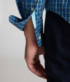 Model is wearing UNTUCKit Wrinkle-Free Castro Shirt in navy.