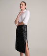 Model is wearing UNTUCKit Celine sequin skirt.