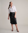 Model is wearing UNTUCKit Celine sequin skirt.