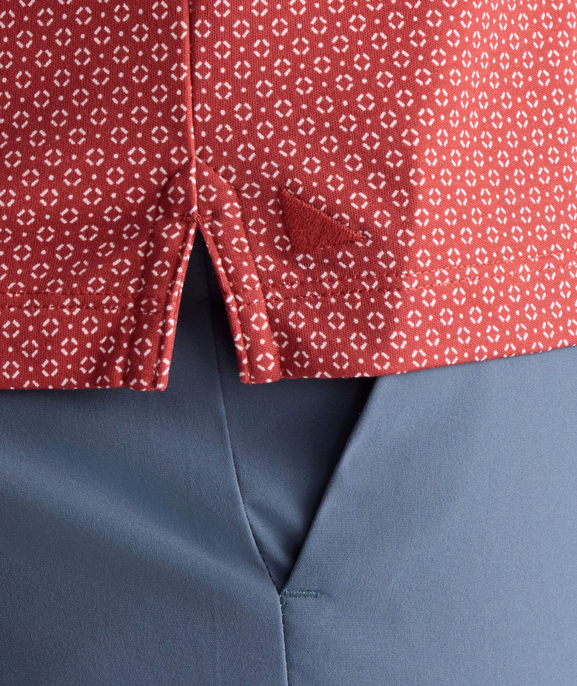 Model is wearing UNTUCKit Wrinkle-Free Damaschino Polo in Red Medallion Print.