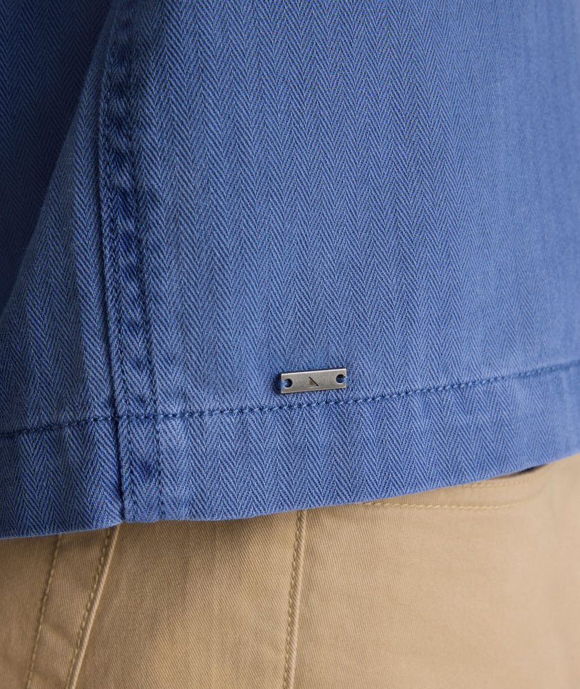 Model is wearing UNTUCKit Chadwick over shirt in Gray Blue. 