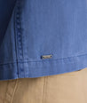 Model is wearing UNTUCKit Chadwick over shirt in Gray Blue. 