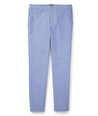 Model is wearing UNTUCKit traveler pants in stone wash.