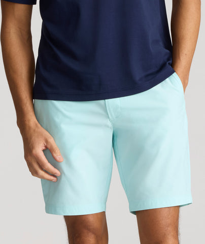 Model is wearing UNTUCKit chancellor short in solid clearwater.