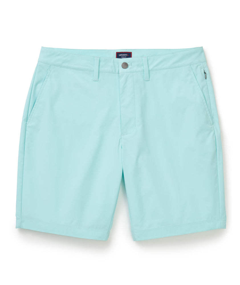Model is wearing UNTUCKit chancellor short in solid clearwater.
