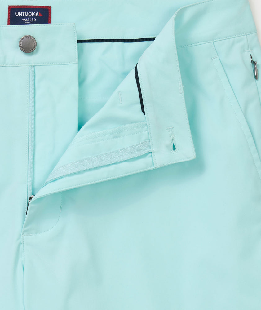 Model is wearing UNTUCKit chancellor short in solid clearwater.