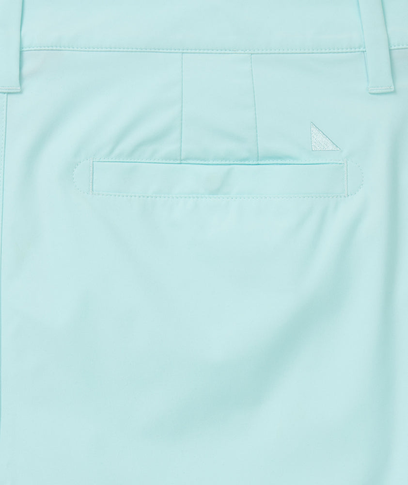 Model is wearing UNTUCKit chancellor short in solid clearwater.