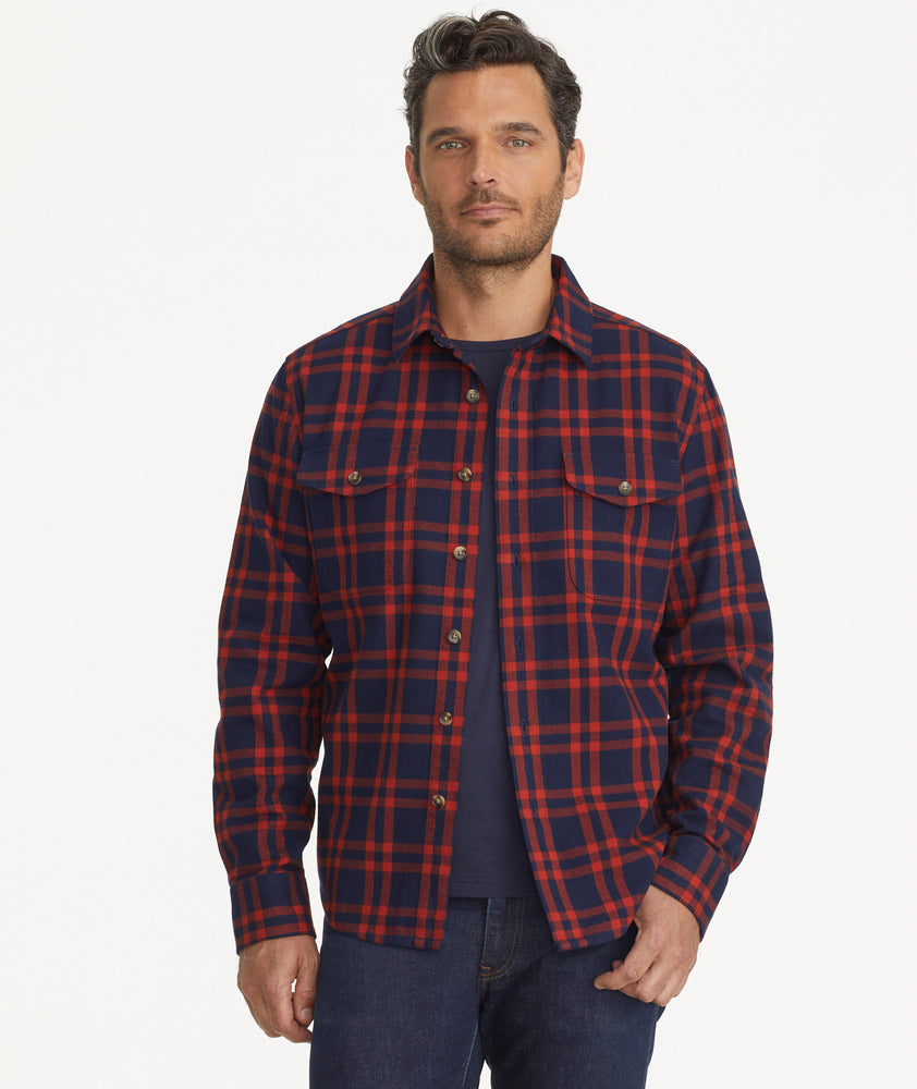Model is wearing UNTUCKit Chaselo Brushed Overshirt in White & Red Check.