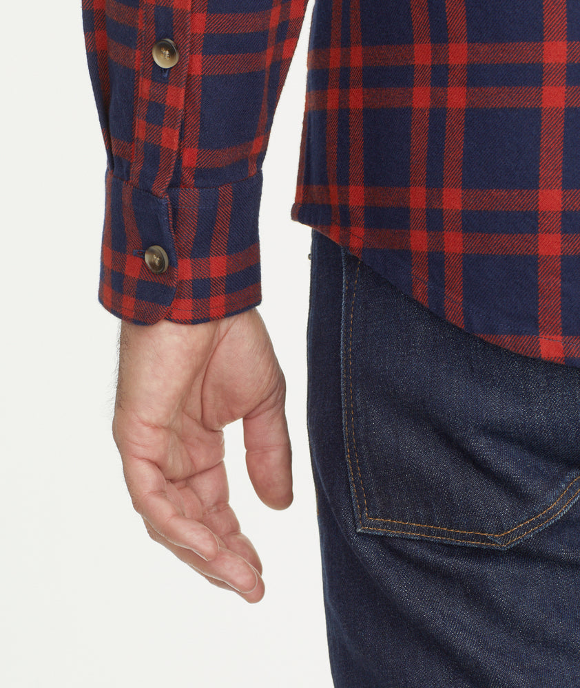 Model is wearing UNTUCKit Chaselo Brushed Overshirt in White & Red Check.