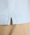 Model is wearing UNTUCKit Chen wrinkle free polo in blue. 