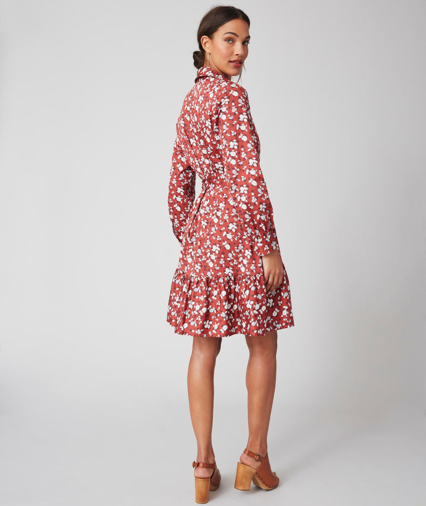 Model is wearing UNTUCKit Chessie Dress in red. 