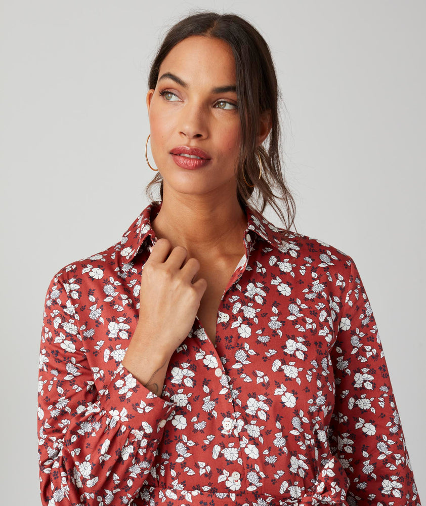 Model is wearing UNTUCKit Chessie Dress in red. 
