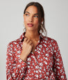 Model is wearing UNTUCKit Chessie Dress in red. 