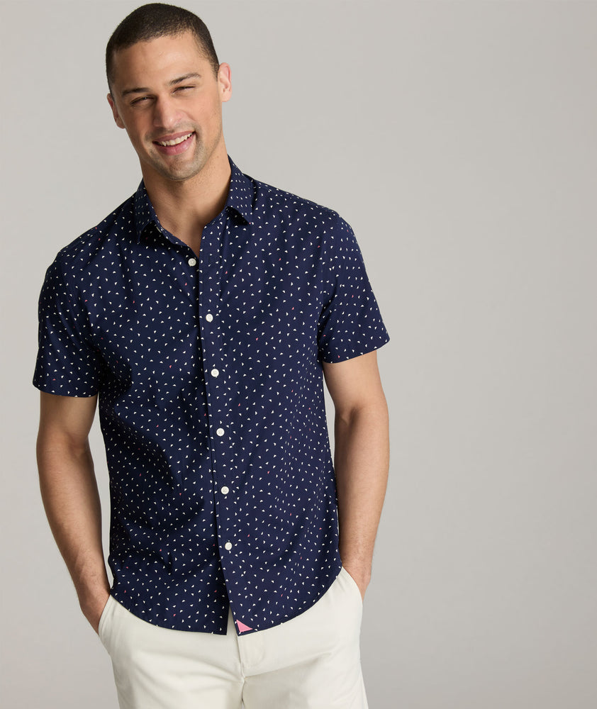 Model are wearing UNTUCKit Cilders short sleeve shirt in navy.