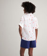Model is wearing UNTUCKit Cotton Tomato Print Chrissy Shirt in Tomato Print.