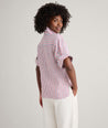 Model is wearing UNTUCKit Linen Chrissy Shirt. 