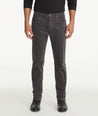 Model is wearing UNTUCKit christow pants in gray.