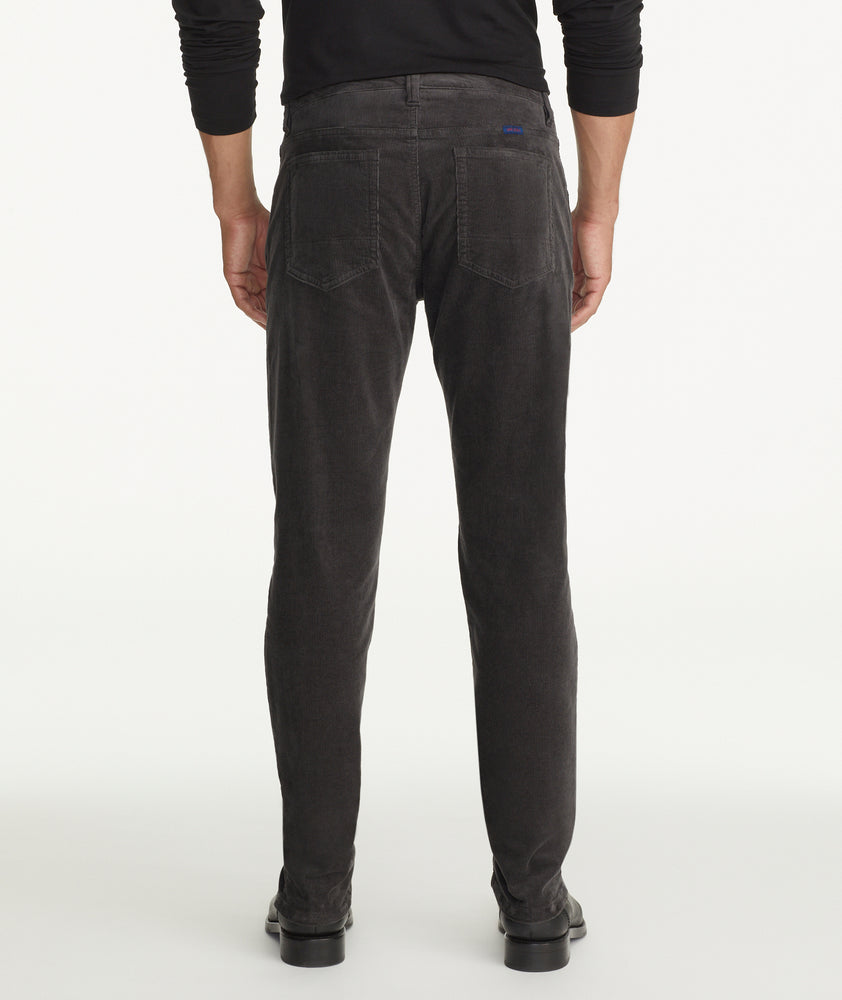 Model is wearing UNTUCKit christow pants in gray.