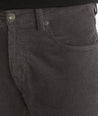 Model is wearing UNTUCKit christow pants in gray.