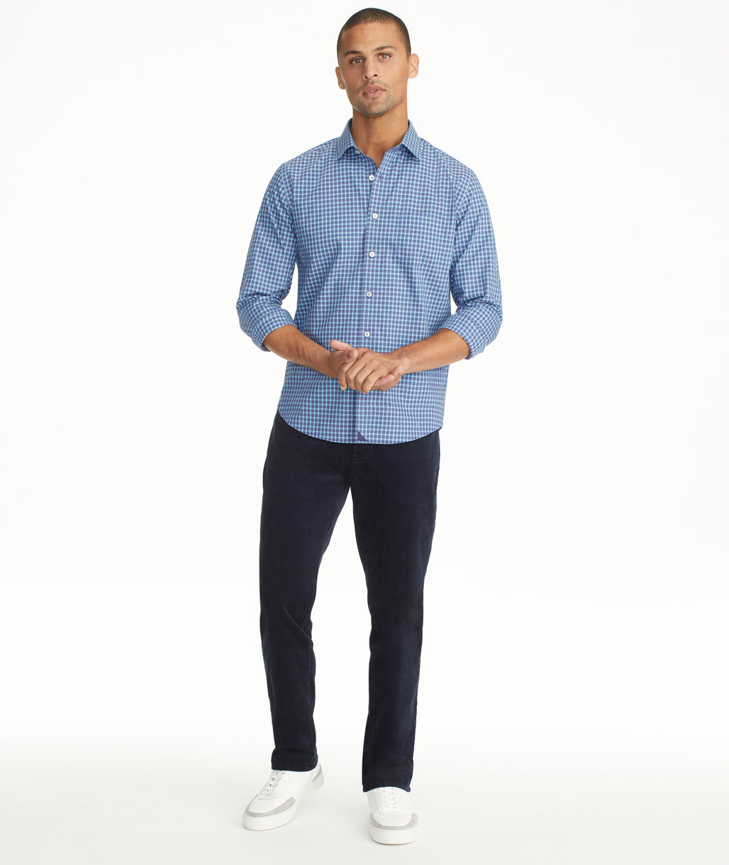 Model is wearing UNTUCKit Christow Cord Pant in Navy