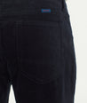 Model is wearing UNTUCKit Christow Cord Pant in Navy