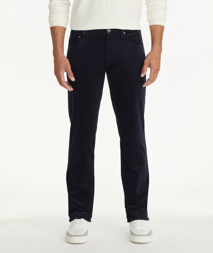 Model is wearing UNTUCKit Christow Cord Pant in Navy
