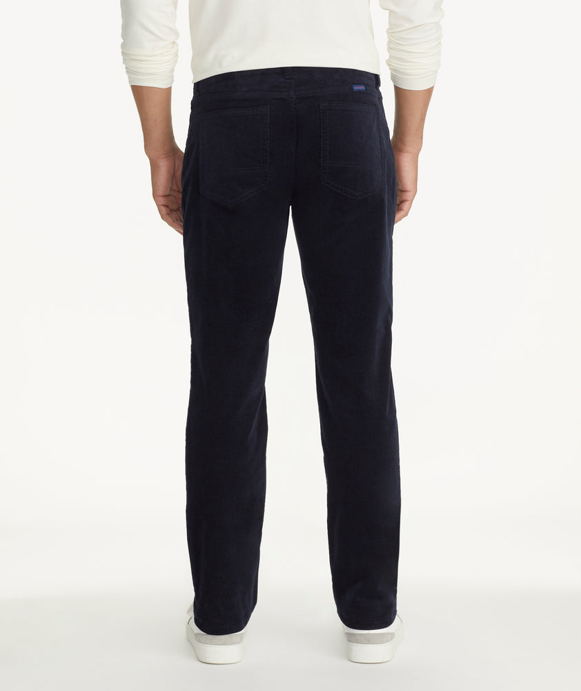 Model is wearing UNTUCKit Christow Cord Pant in Navy