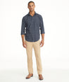 Model is wearing UNTUCKit Christow Cord Pant in Tan.