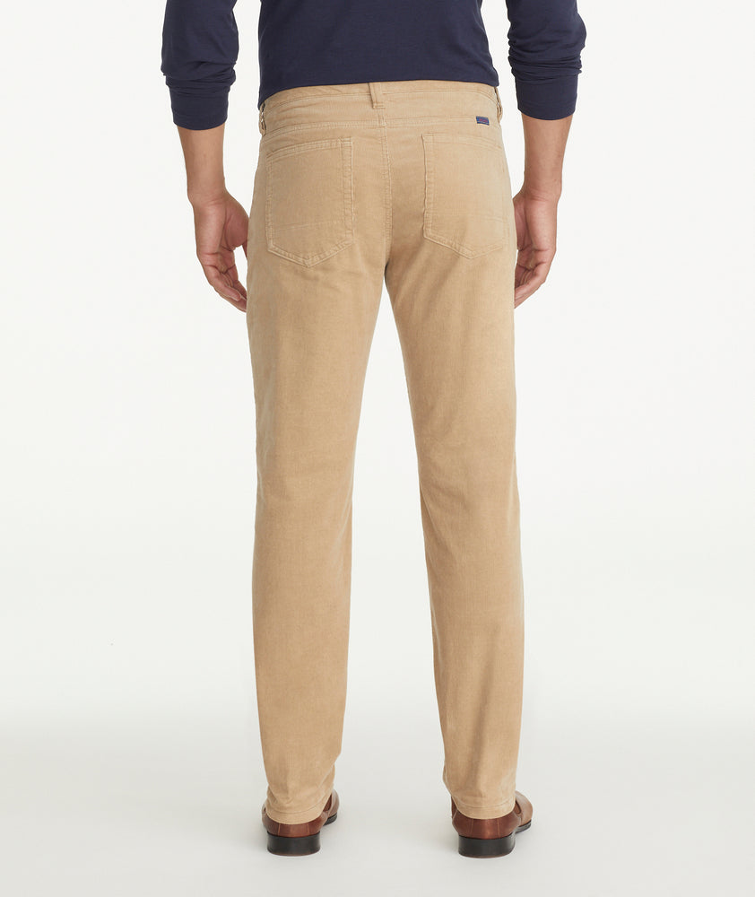 Model is wearing UNTUCKit Christow Cord Pant in Tan.