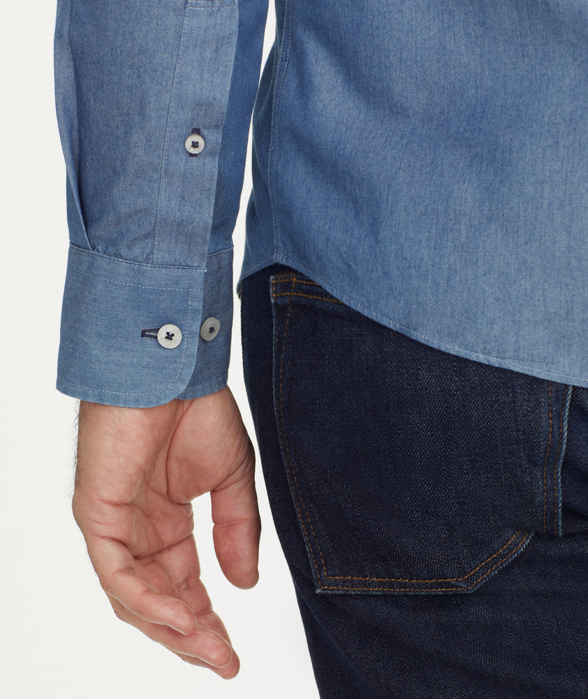 Model is wearing UNTUCKit Wrinkle-Free Cinzano Shirt in Light Blue Chambray.