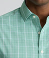 Model is wearing UNTUCKit CottonTek Claremont Shirt in green.