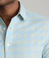 Model is wearing UNTUCKit Clark wrinkle-free shirt in green. 