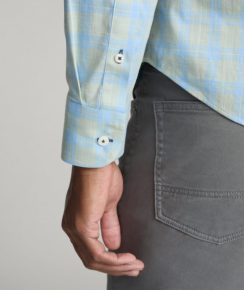 Model is wearing UNTUCKit Clark wrinkle-free shirt in green. 