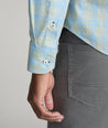 Model is wearing UNTUCKit Clark wrinkle-free shirt in green. 